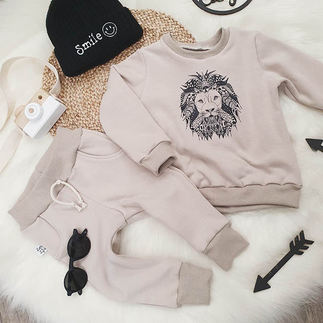 Handmade baby & toddler lounge wear. Beige tracksuit printed with Lion Motif.