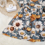 blue dress with floral and bee print details by Lottie & Lysh