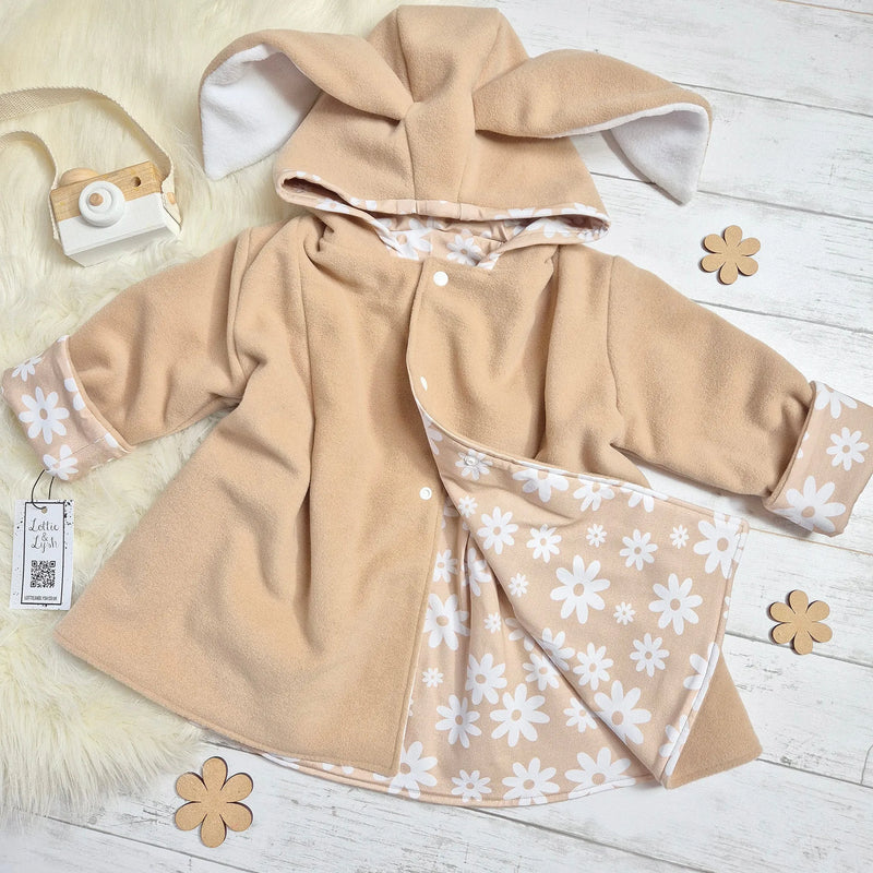 Beige bunny jacket with neutral flowers lining. Handmade by Lottie & Lysh in the UK