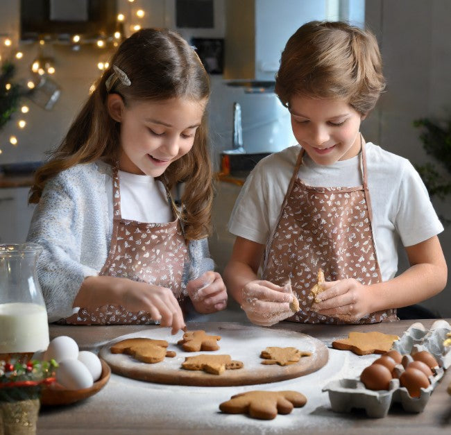 kids baking gingerbread men cookies