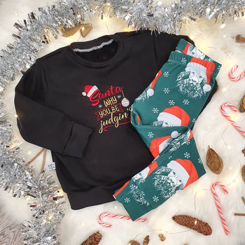 Lottie & Lysh Christmas leggings with festive aztec lion print wearing a santa hat