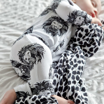 newborn baby boy wearing Lottie & Lysh signature aztec lion print baby romper