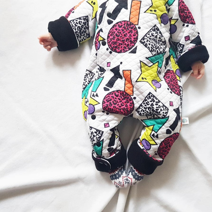 colourful baby clothes collection by Lottie & Lysh. 80s inspired printed baby and toddler pramsuit lined with black fleece