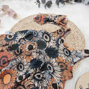 flat lay close up of the Lottie & lysh vintage floral summer romper for kids