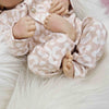 newborn baby wearing Lottie & Lsyh gender neutral leopard print baby romper