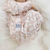 Lottie & Lysh beige baby romper in leopard print handmade in the UK