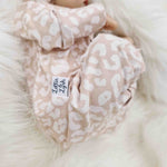 Lottie & Lysh beige baby romper in leopard print handmade in the UK