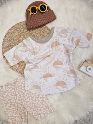 neutral kids clothing sunrise top with leopard print shorts