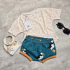 a kids outfit featuring a beige leopard print t-shirt and puffin print shorts