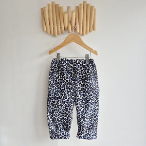 kids leopard print cord trousers in blue, black and white.