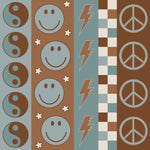 Vintage Stripes jersey fabric with smiley faces, thunder bolts and ying yangs for use in baby and childrens clothing. Made by UK based brand Lottie & Lysh