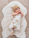cute baby boy wearing a netural sun print baby romper by lottie and lysh uk