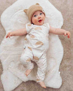 neutral baby romper with sun print detail
