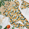 orange print baby and toddler romper by Lottie & Lysh
