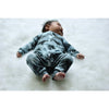 Baby wearing monochrome romper made by Lottie & Lysh