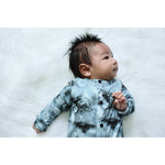 Newborn baby wearing tie dye effect romper made by lottie & lysh