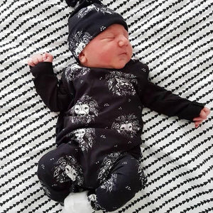 Lion baby clothes by Lottie & Lysh. Signature Lion Noir print zipless romper with matching hat