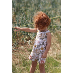 red haired little girl wearing a vintage floral playsuit handmade by Lottie & Lysh