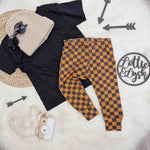vintage checkerboard leggings for kids. Skate inspired Baby and toddler outfit flat lay.