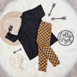 cool kids flat lay outfit inspiration featuring lottie and lysh boys checkboard leggings, black t-shirt, black sunglasses and beige knitted hat