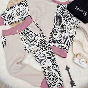 flaylay image featuring a light colour animal print tracksuit for girls and knitted beanie hat with smiley face logo