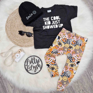 cute kids outfit by Lottie & Lysh. Printed leggings, black beanie had and printed t-shirt