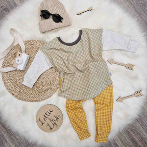 Sage green grid print long sleeve t-shirt by lottie and lysh, with mustard grid leggings, beige beanie hat and sunglasses
