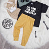 Kids outfit flat lay featuring lottie and lysh mustard grid leggings and monochrome slogan t-shirt