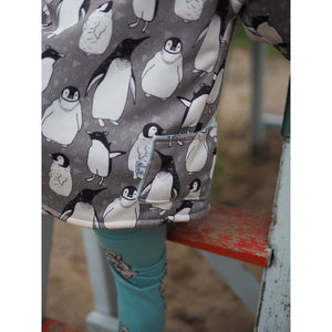 lottie and lysh penguin splasher pocket detail on raincoat