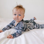 cuyte baby wearing a handmade owl romper by lottie and lysh