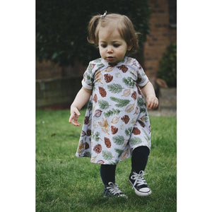 Cute toddler girl wearing the organic festive leaves print t-shirt dress by lottie & lysh