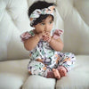 Baby girl wearing organic baby romper confetti frill should romper handmade by Lottie & Lysh UK