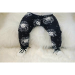Black and white lion printed child and baby leggings matched with cute white baby shoes with black laces