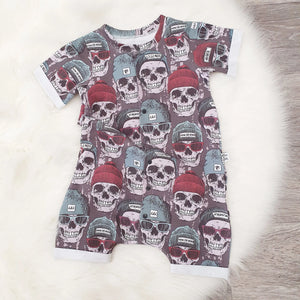 Kids summer romper in a skate inspired skull print jersey fabric. Handmade in the UK by Lottie & Lysh