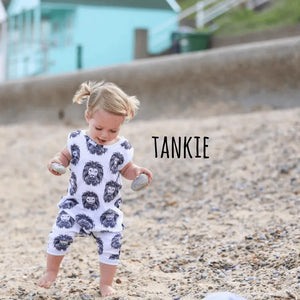 Toddler girl wearing a lottie and lysh tankie style zipless romper in aztec lion