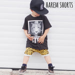 Toddler boy wearing Lottie & Lysh harem shorts in mustard spot