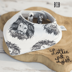 Flay lay image of a lottie and lysh bib in aztec lion 