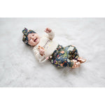 laughing baby girl wearing lottie & lysh autumn glow baby leggings, headband and gold baby slippers