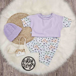 Kid's 90s style crop top and shorts set. Confetti print and lilac.